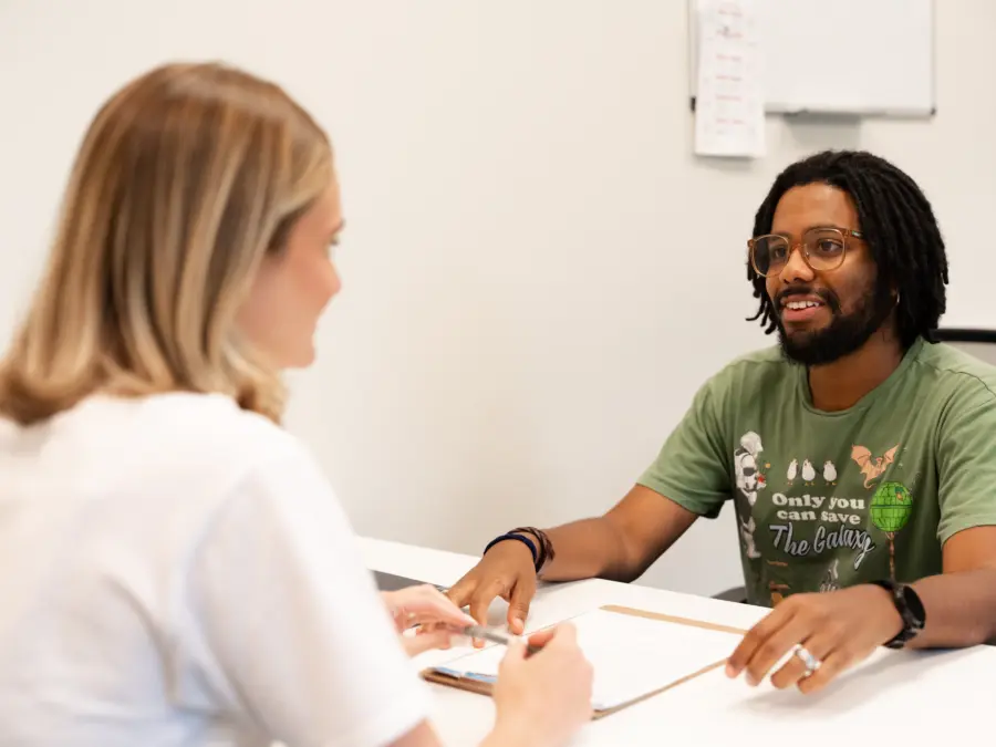 Board Certified Behavior Analyst (BCBA) working with a child during an ABA therapy session to support communication and skill development.