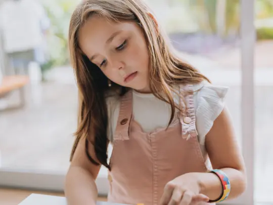 Autistic child playing with puzzle