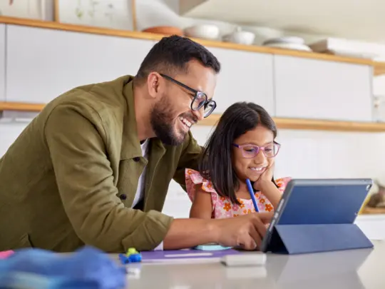 Parent looking at insurance coverage so kid can apply for ABA therapy services