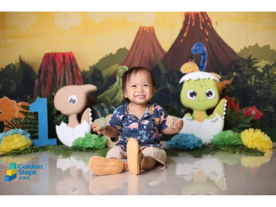 One-year-old boy with autism sitting and playing with toys during an early developmental assessment, highlighting the importance of early diagnosis and intervention.